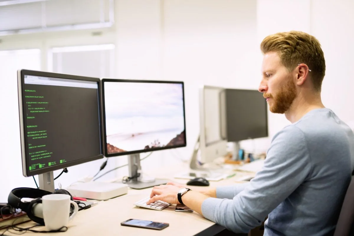 Man working on the computer at an office desk