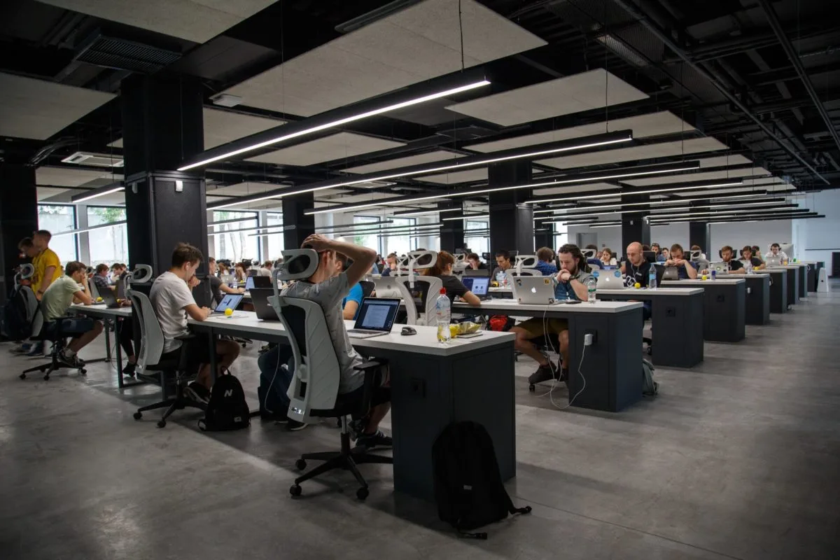 People on laptops in an office setting