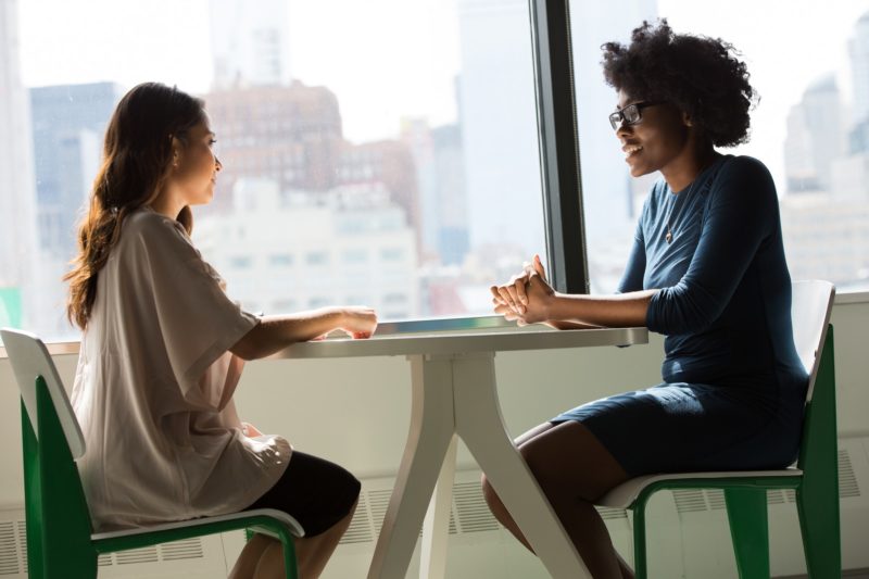 Two women in a programming interview sat at a table