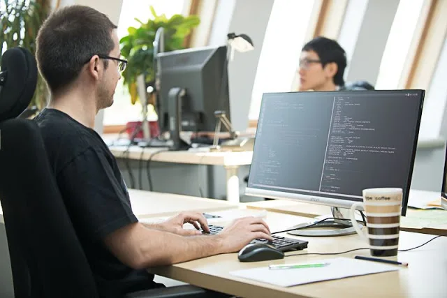 A developer in front of a computer
