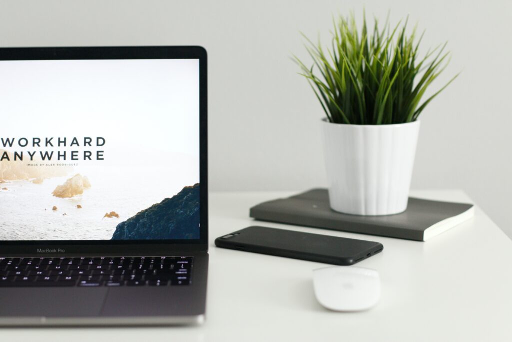 An equitable recruitment process leads to a more diverse engineering team. Laptop with “work hard anywhere” on the screen